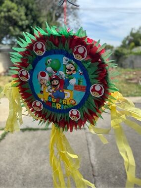 Super Mario Red & Green Party Piñata with Yellow Streamers